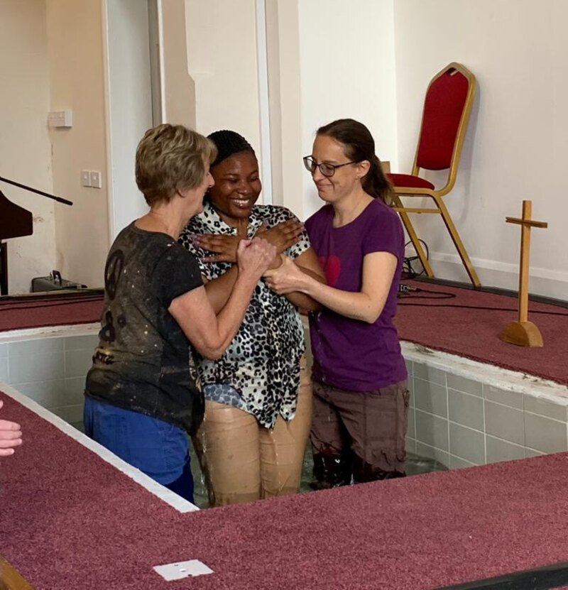 A lady being baptised